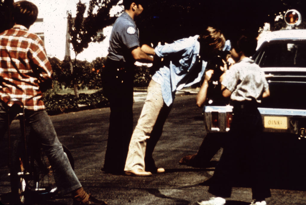 student being picked up by the police